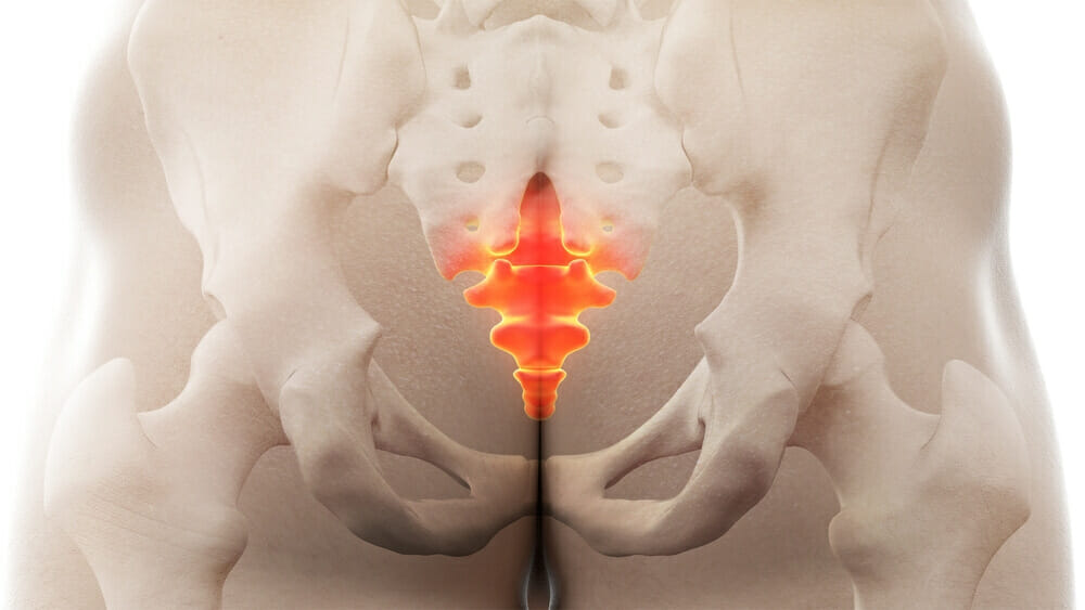 Tailbone pain cause, symptoms and treatment with 5 exercises