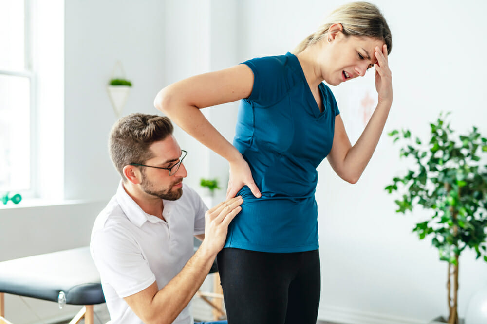 Woman suffering from hip pain
